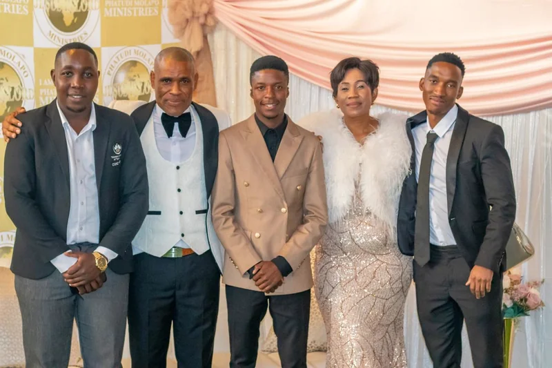 Pastor Phatudi Molapo and ministry family standing together
