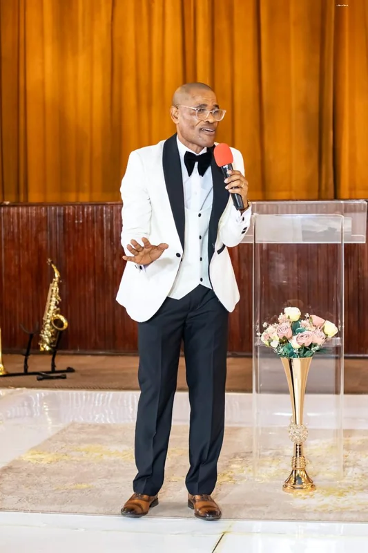 Pastor Phatudi Molapo teaching with a microphone