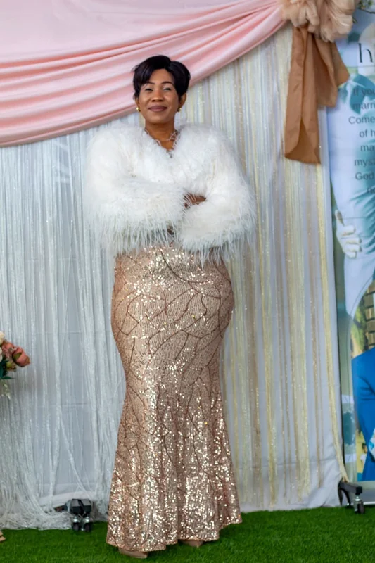 Woman dressed elegantly for a ministry celebration