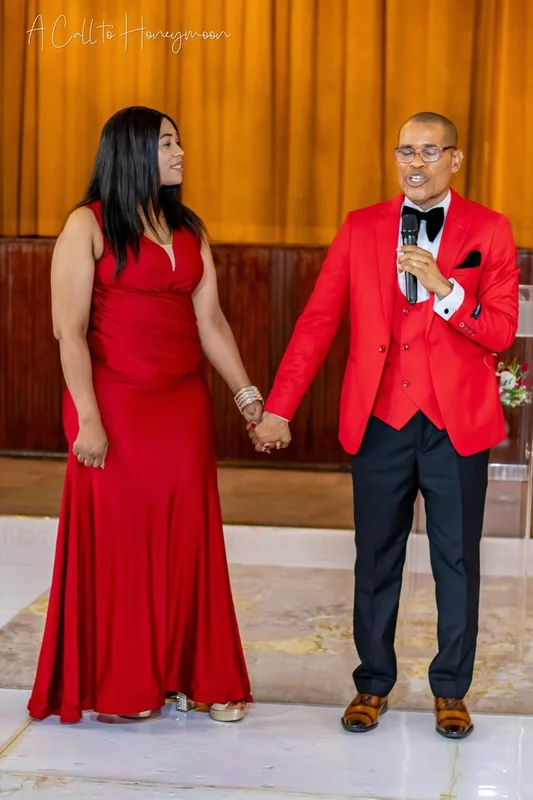 Pastor Phatudi Molapo speaking while holding hands during a marriage event