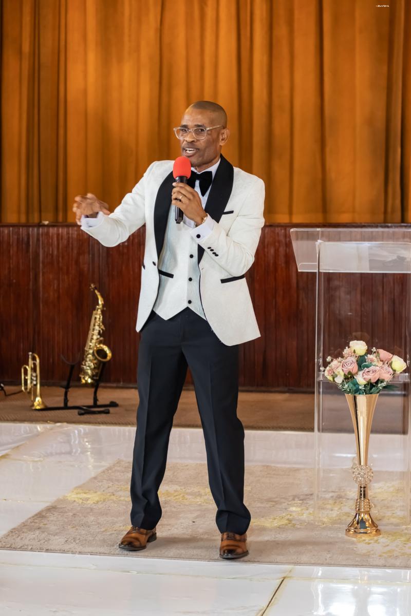 Pastor Phatudi Molapo speaking at the lectern