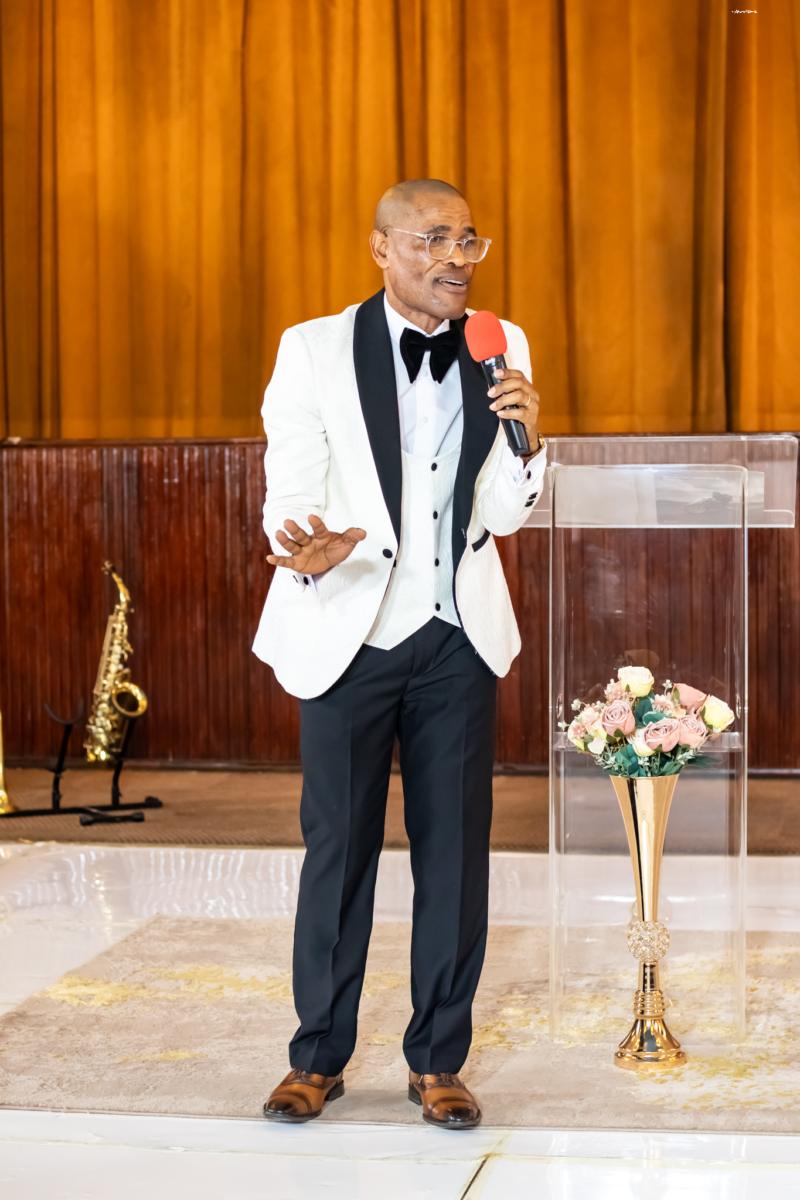 Pastor Phatudi Molapo teaching with a microphone