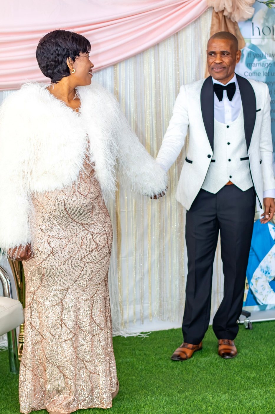 Pastor Phatudi Molapo and his wife holding hands