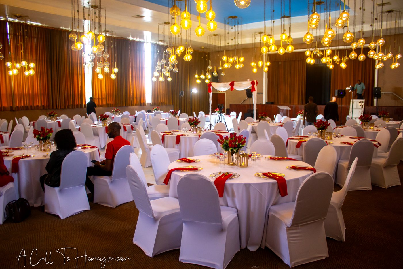 Large hall prepared for a red and white ministry celebration