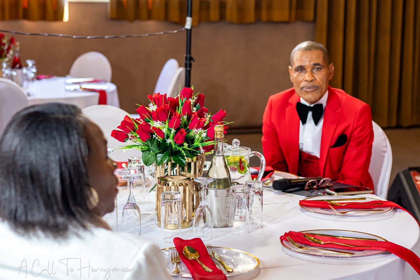 Pastor Phatudi Molapo seated at a celebration table