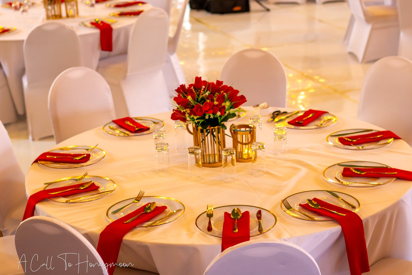 Red and gold table setting prepared for guests