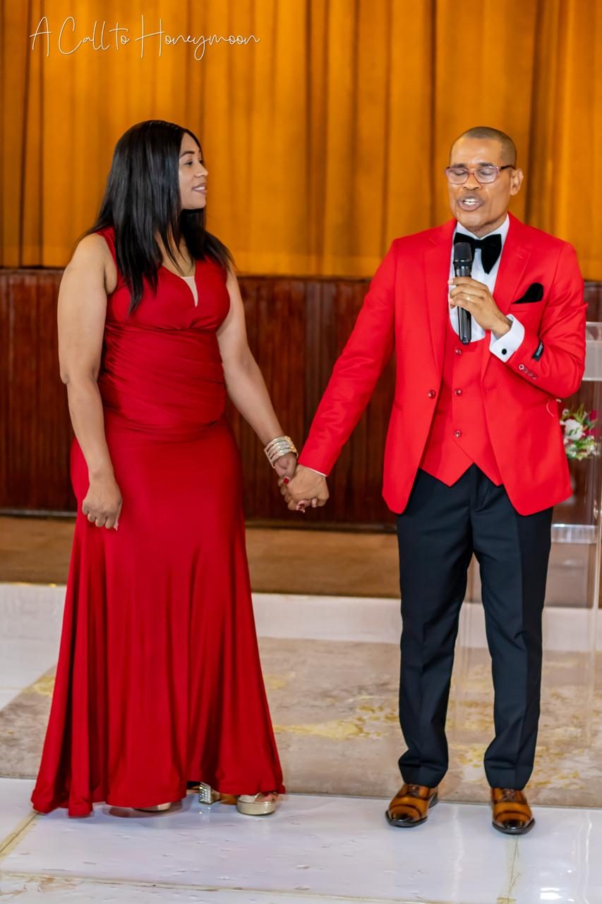 Pastor Phatudi Molapo speaking while holding hands during a marriage event