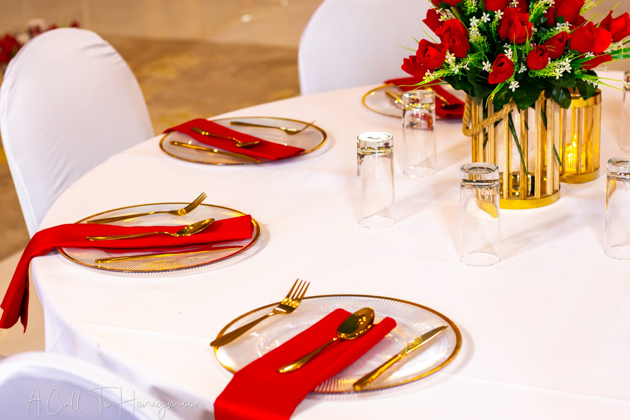 Red and gold table setting prepared for guests