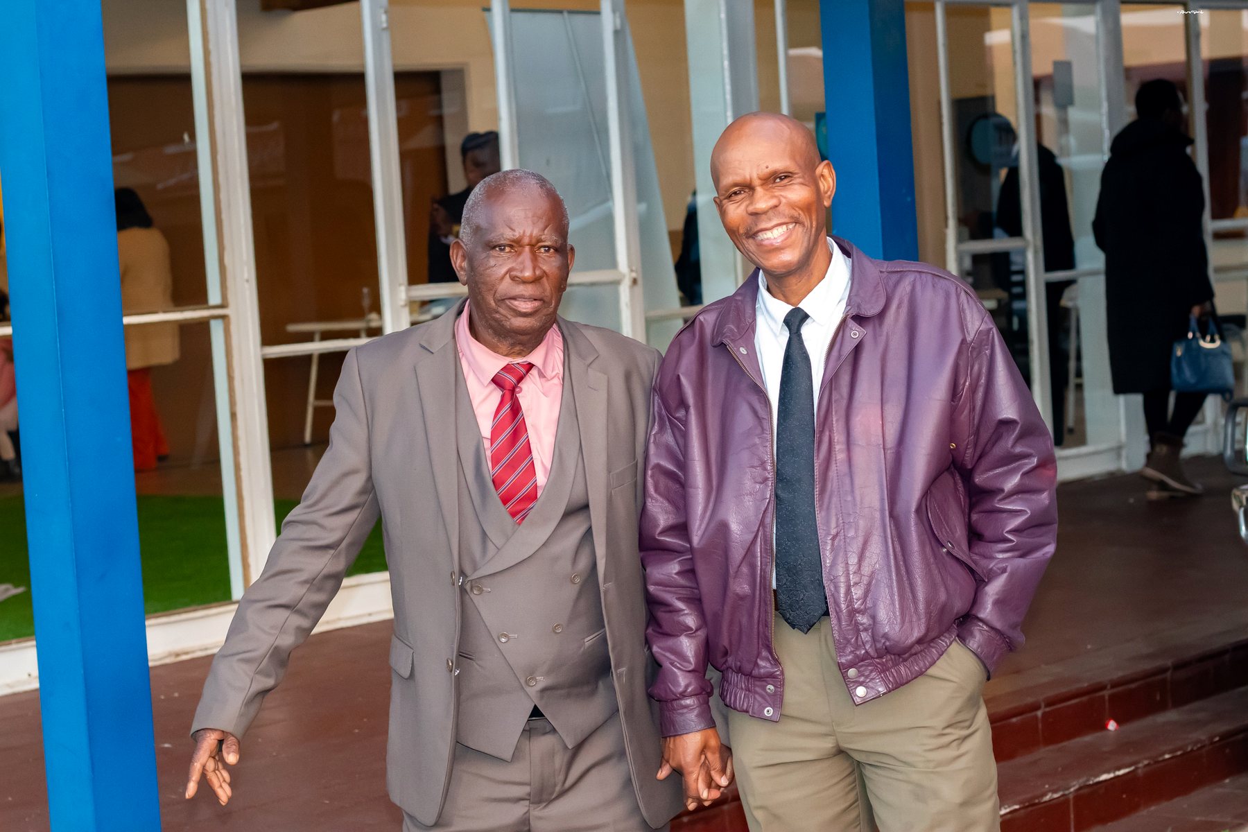 Two men standing together outside the ministry venue